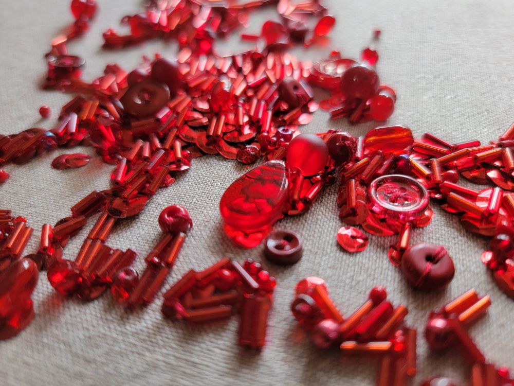 A closeup of the beadwork, looking like an abstract art piece.