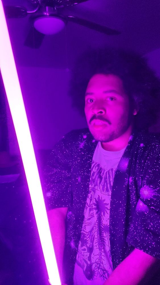 Posing again with purple light saber in space kimono. 