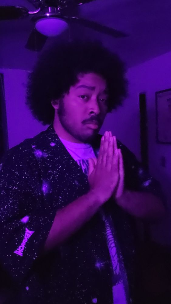 Posing with prayer hands in a space Kimono