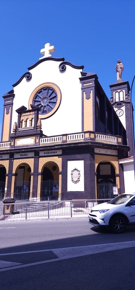 An old Iglesia in downtown barakaldo reading "Maria purinisma." The word on the far left is cut off. 