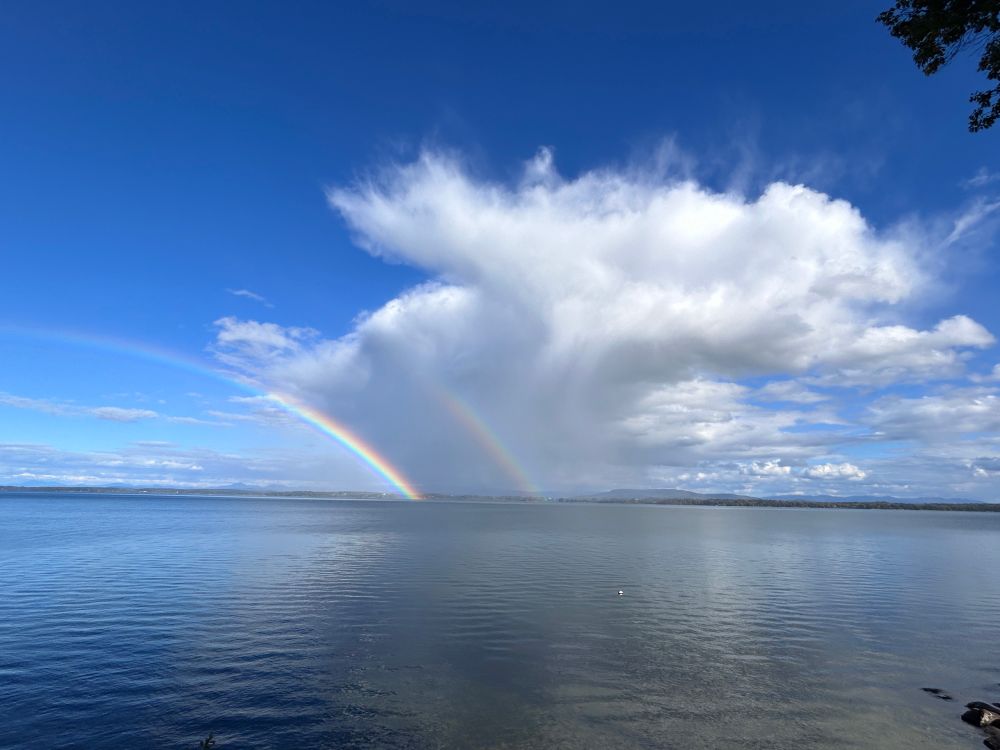 double rainbow in clouds on lake Champlain 