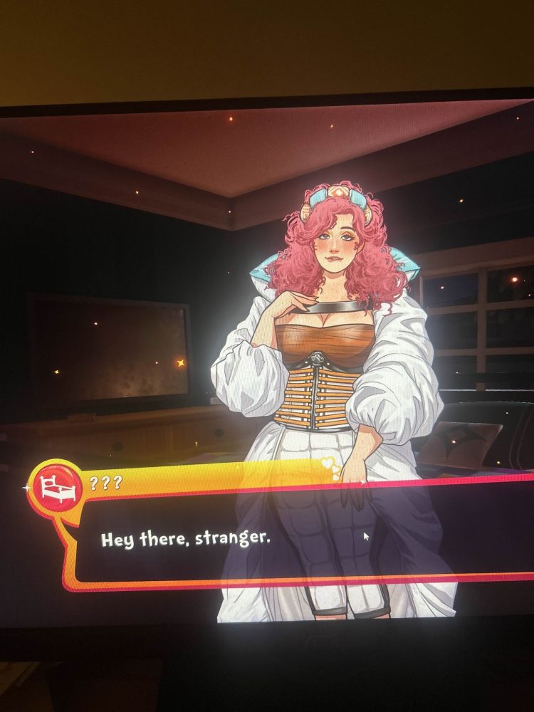 a screenshot from the dating sim date everything with the bed character, betty. she is a white woman with pink curly hair, large breasts, and a white shirt.