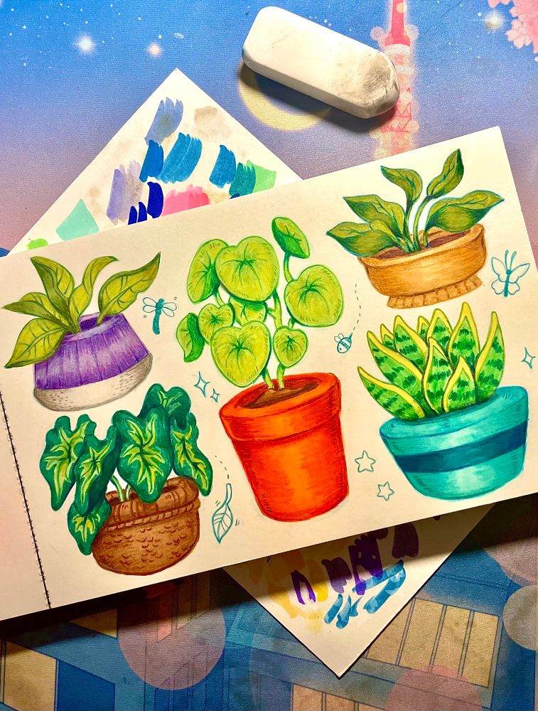Plants colores in a sketchbook with traditional media.