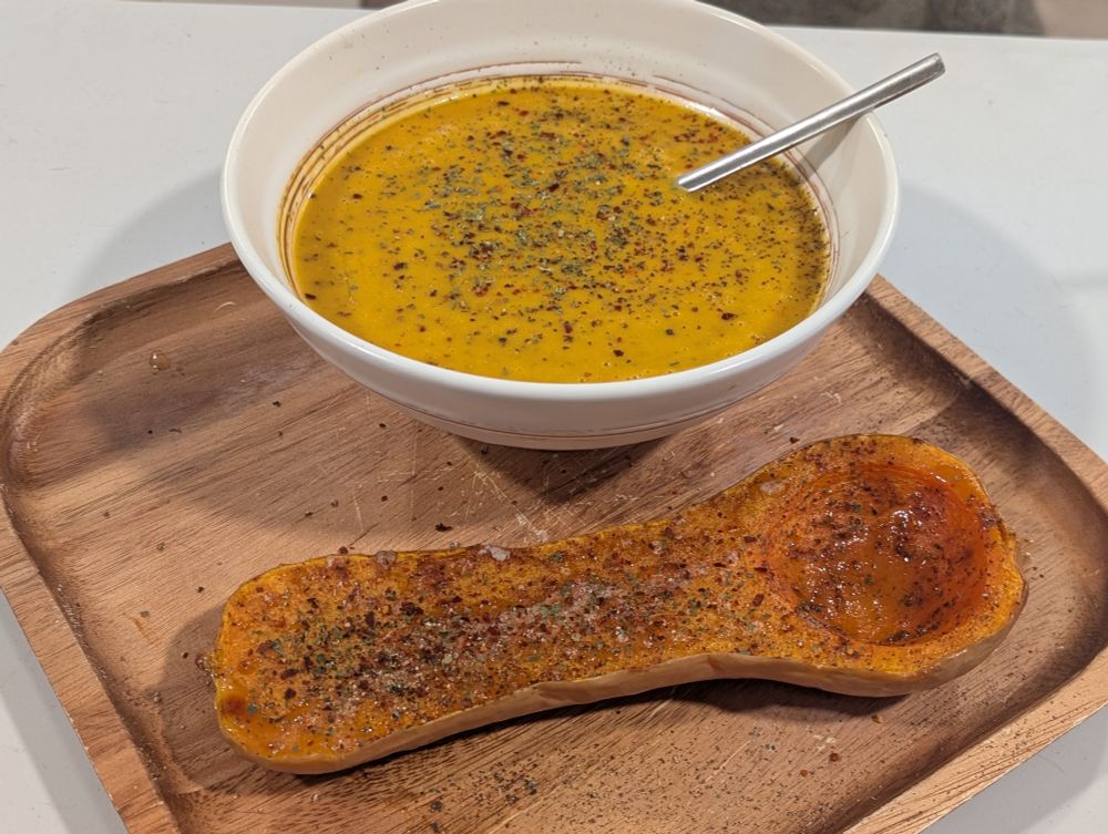 Curry butternut squash soup and the other half of the roasted butternut squash that I ate on its own alongside the soup