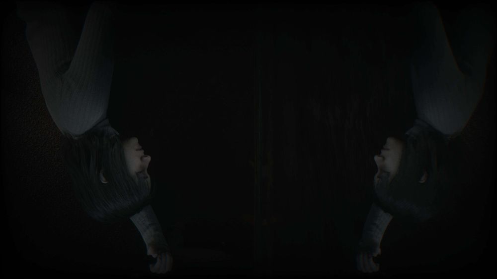 Silent Hill 2 Remake Screenshot. Angela lying down holding a knife and looking at herself in the mirror.