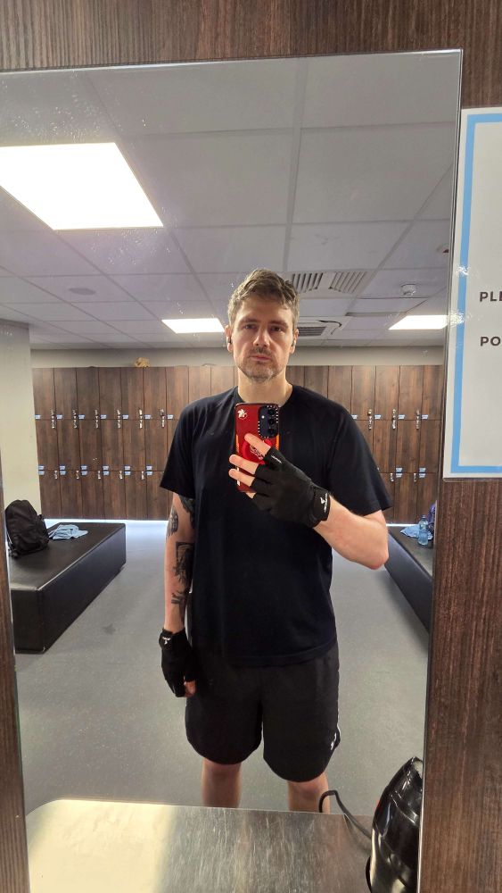 me tired in the gym wearing all black