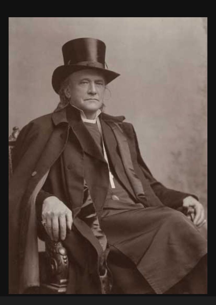 Sepia portrait photo of Bishop Whipple in a top hat and what looks like Dracula’s cape. 
