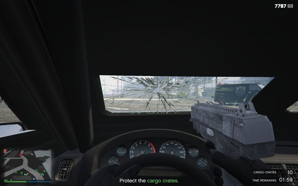 screenshot of first person perspective in GTA Online in a car and it's mostly armor plating and a shattered windshield