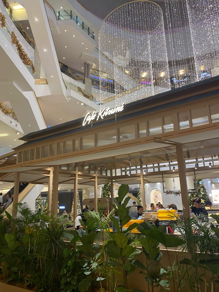 Cafe Kitsune, located in Pavilion Mall, Malaysia. The cafe is a standalone establishment located in the middle of a large and modern atrium.
