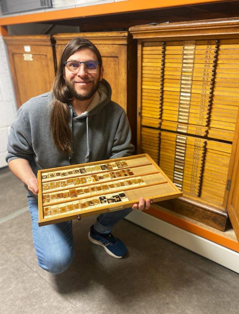 Javier Luque, Curator of crustaceans & non-insect arthropods at Cambridge University Museum of Zoology, holding a drawer with some of the barnacle slides from Charles Darwin’s collection