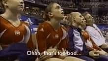 Gymnast making a token attempt to feel bad that her competition just fell, saying " Oh that's too bad" and a very unconvincing and hilarious tone