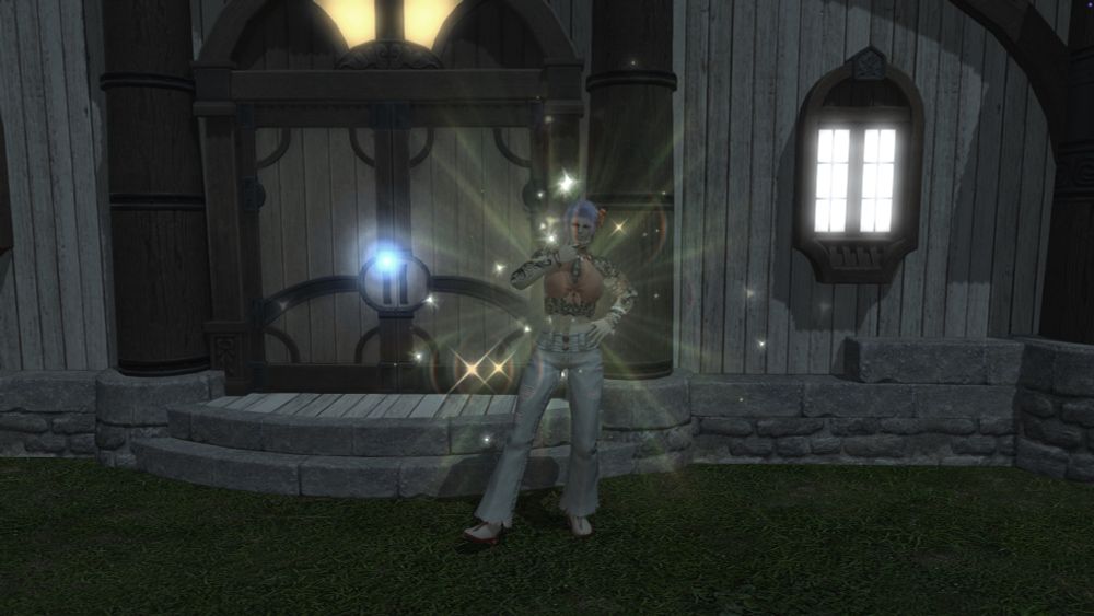 A Roegadyn woman stands outside of a house plot reenacting the "Humble Triump" emote.