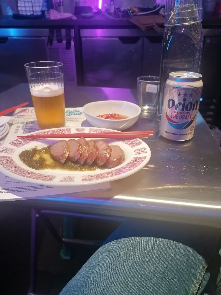 A beer and an Asian meal