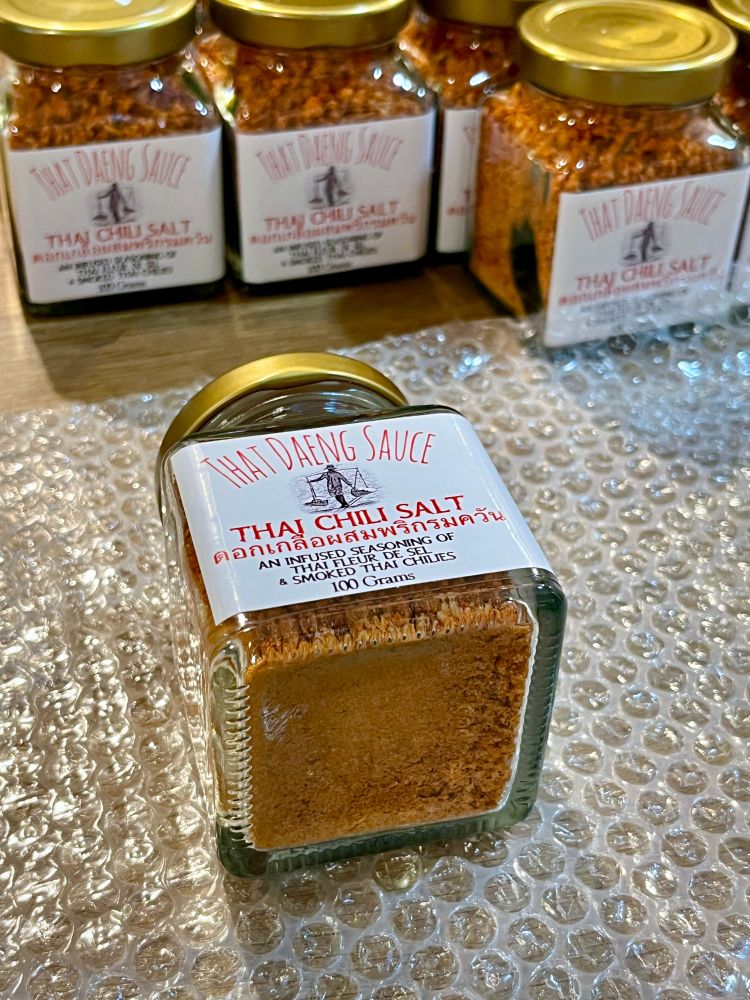 Order of 24 bottles of That Daeng Sauce Thai Chili Salt being wrapped to ship.