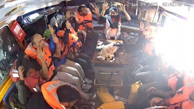 Everyone sitting in the Freedom Flotilla boat with their hands above their heads, taken from the official Telegram channel 