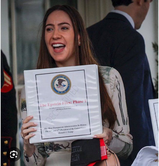Chaya holding The Epstein Files: Phase 1 