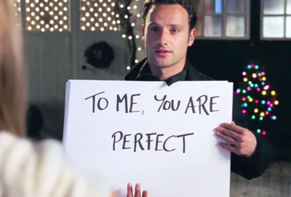 Scene from Love Actually with Andrew Lincoln holding up a placard 