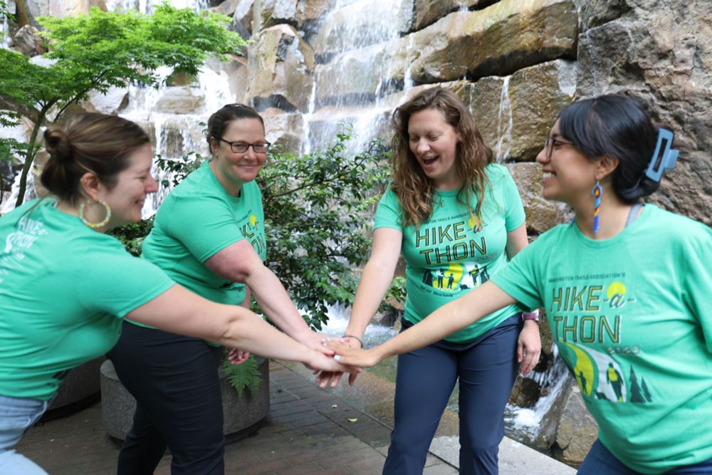 A huddle of hikers prepare to kick off Hike-a-Thon, WTA's annual fundraiser to support trails. Sign up or donate today!