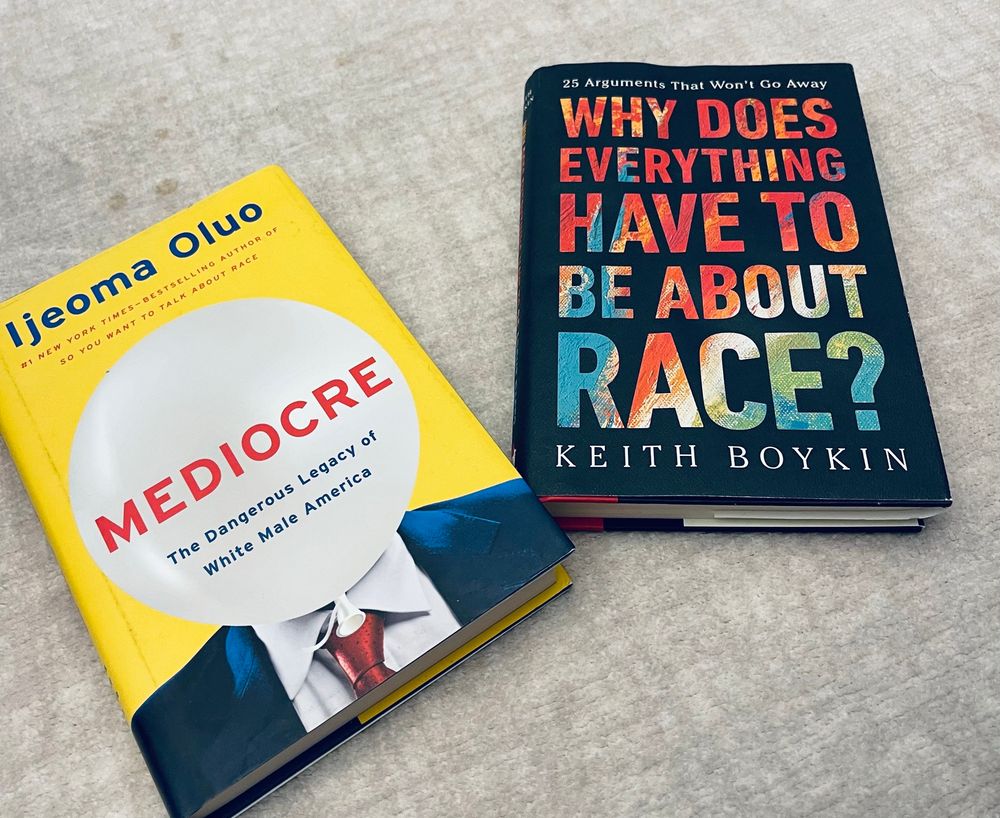 2 books pictured, Mediocre: The Dangerous Legacy of White Male America by Ijeoma Oluo and Why Does Everything Have to be About Race by Keith Boykin