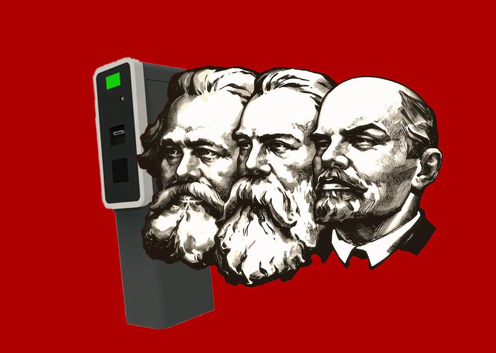 The famous picture of Lenin, Engels and Marx on a red background.
A parking validation machine is edited in next to them.