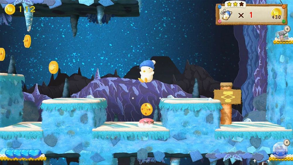 A bird guy jumping through a cavern collecting coins.