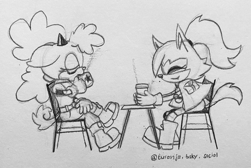 Lanolin and Whisper are sitting at a table together. Lanolin drinks from her Restoration-branded mug, while Whisper holds a paper coffee cup.
