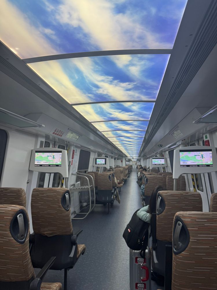 a train with fake sky panels. each panel is identical 