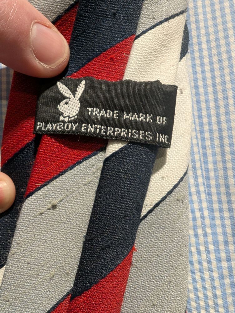 Back of the tie. Label reads "Trade mark of Playboy Enterprises INC"