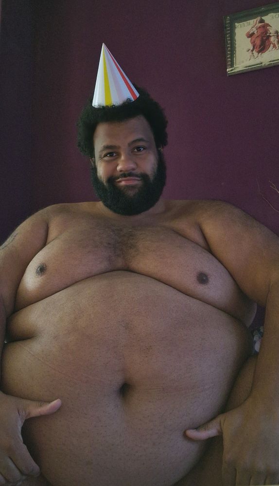 Me, a big sexy superchub, wearing a festive hat for his birthday