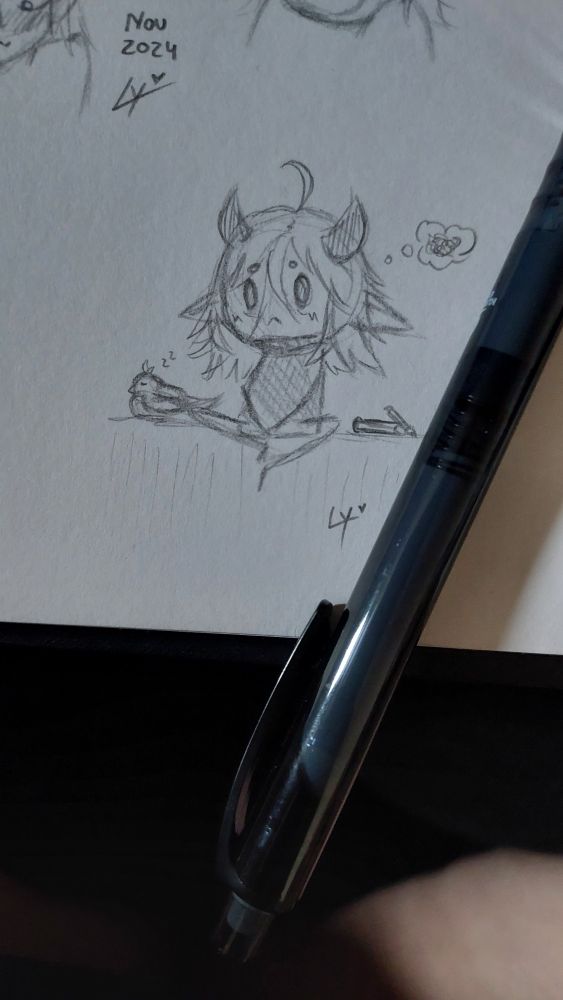 A little chibi of the artist looking sad, they sit with crossed legs, a sleeping little bird and a sketchbook on either side of them. 