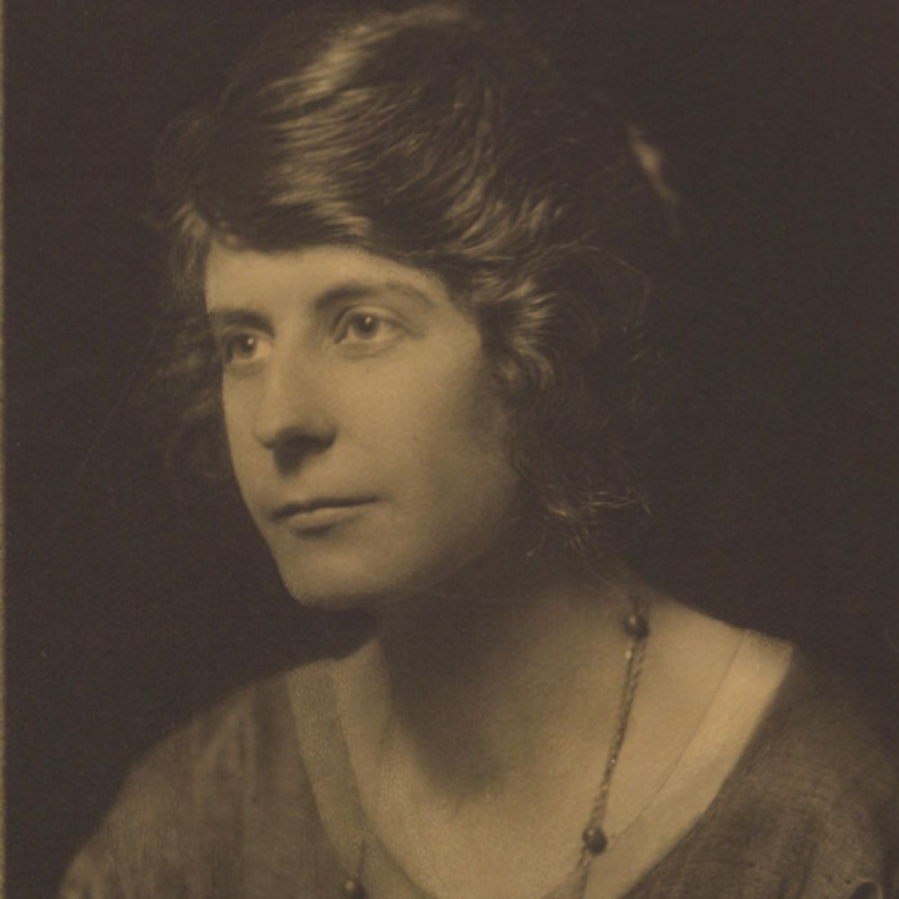 A portrait photograph of a young Vera Douie.