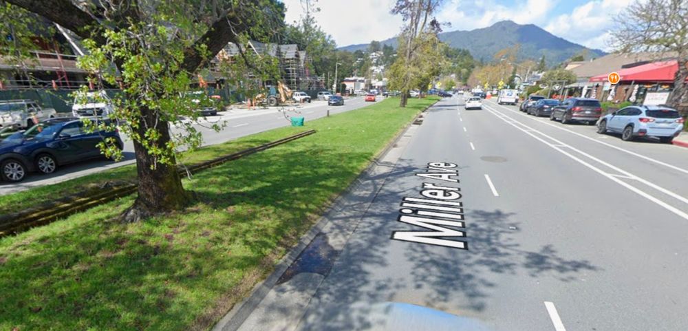 Google Street view of Miller avenue in mill valley, with 2 lanes, a bike lane, and parking in each direction, plus a very wide grassy median.