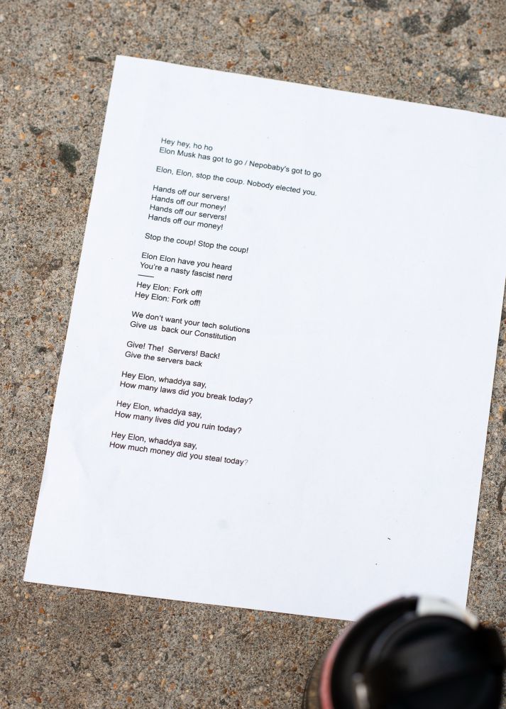 A chant sheet that reads a variety of chants calling out Elon Musk for stealing the server data. 