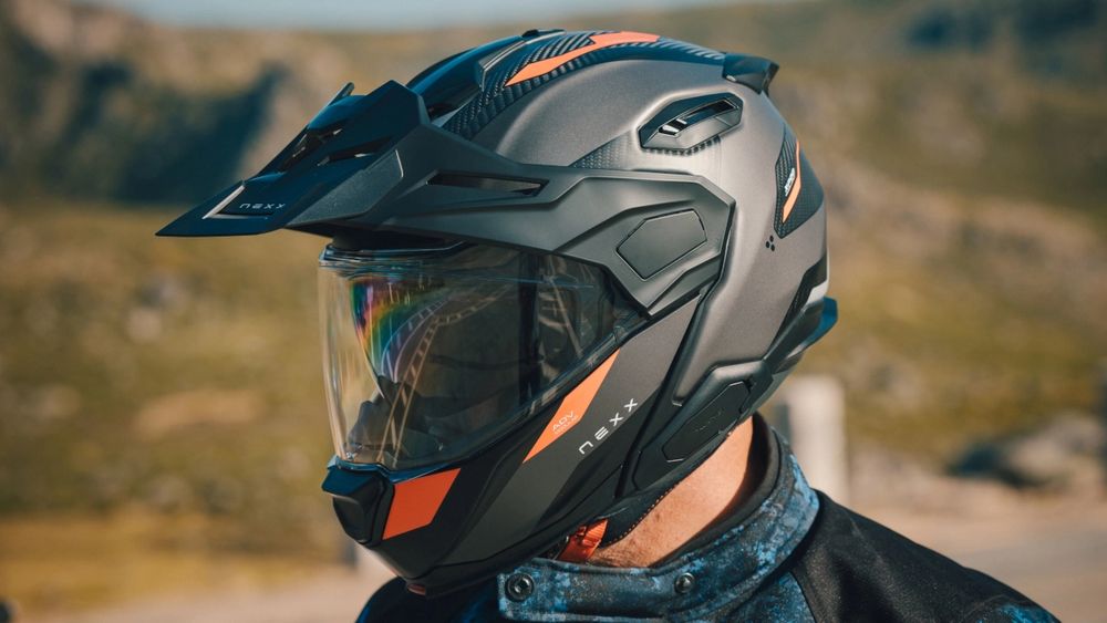 The new NEXX X.LIFECOUNTRY CARBON is essentially 3-4 motorcycle helmets in one very lightweight package, with a modular flip-front, off-road peak and touring features all combined into the design.