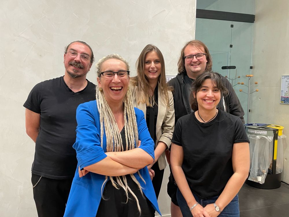 Five people standing and smiling at the camera, tired but extremely content!