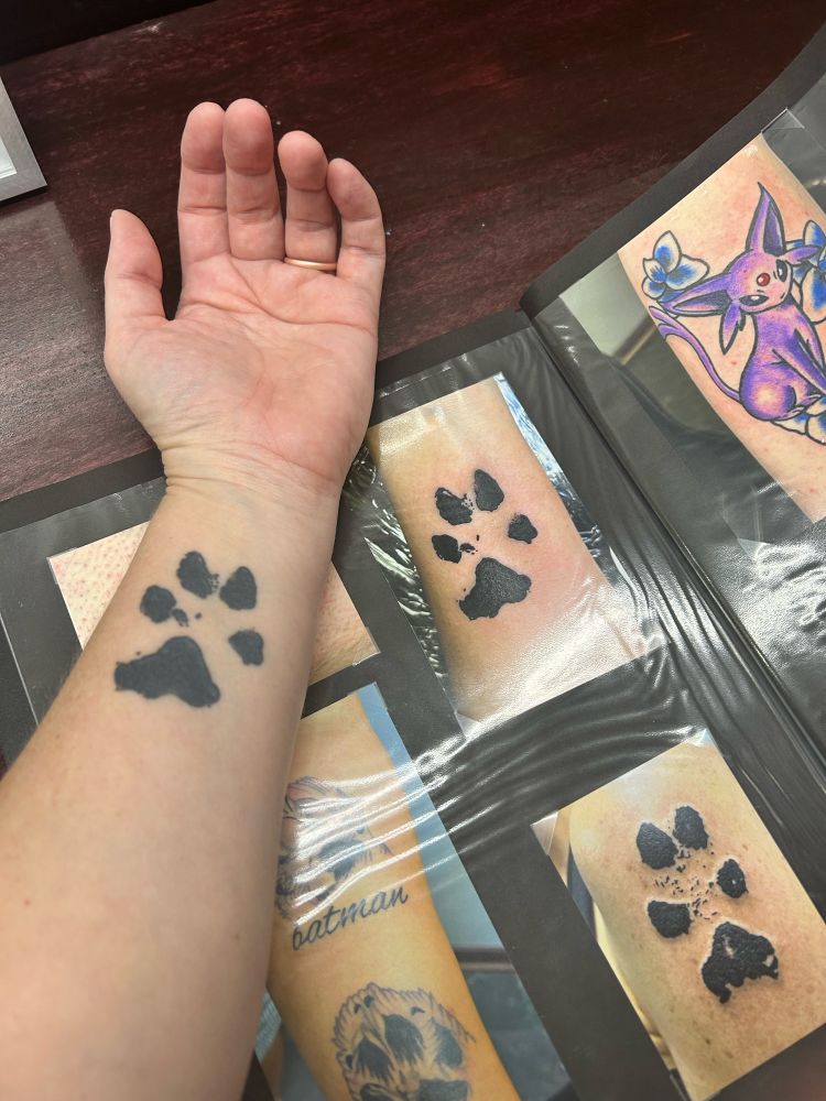 Picture of my forearm with paw tattoo beside a photo of my paw tattoo in the artist’s look book