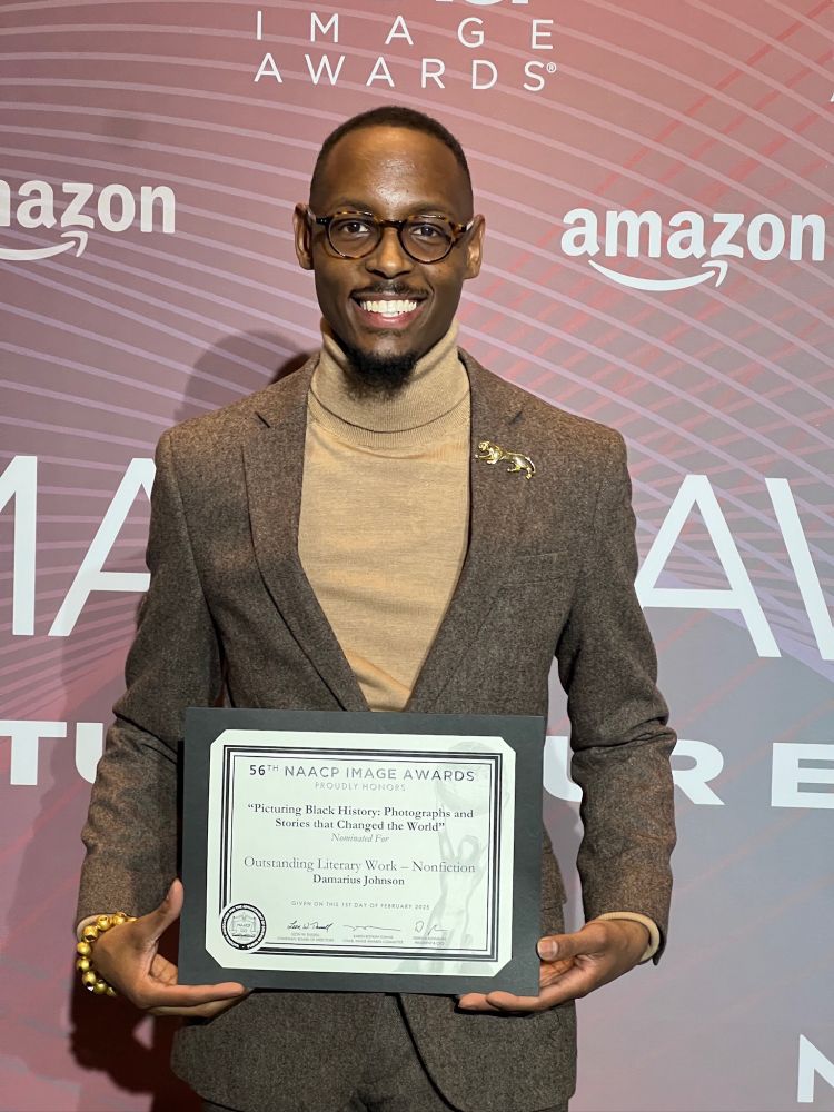 Damarius Johnson represented the Picturing Black History team at the NAACP Image Awards reception. Our Book, "Picturing Black History" was nominated for an NAACP Award. He is holding a certificate that confirms the nomination. 
