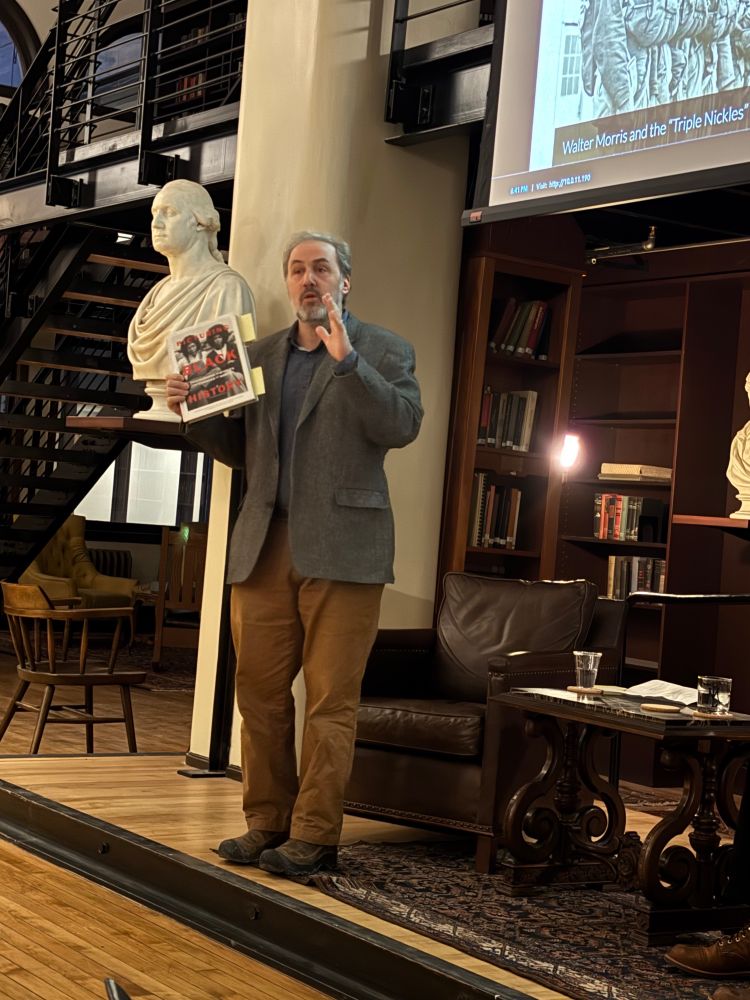 Steven Conn holding a copy of Picturing Black History.