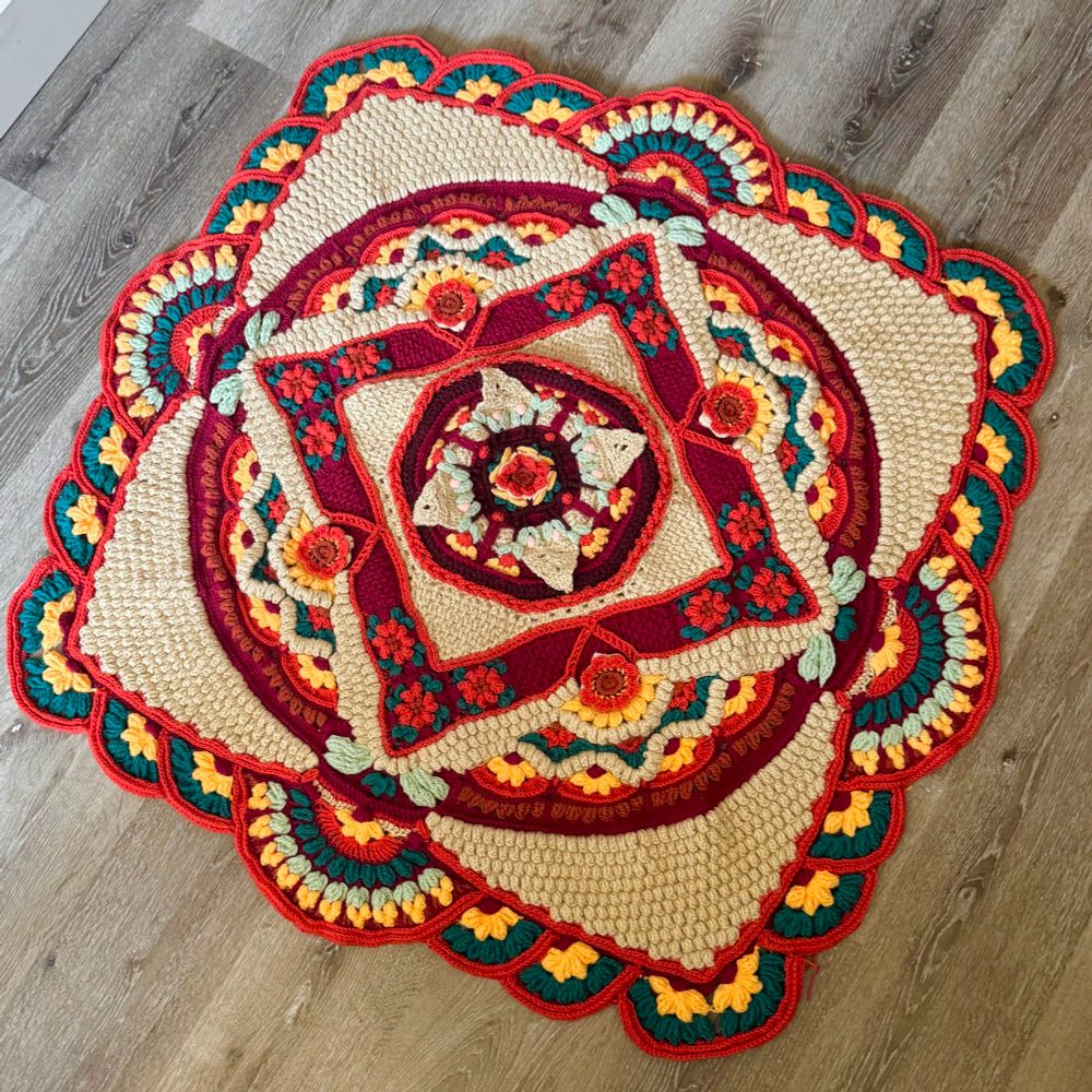 Photo of a crochet blanket, pattern is called the Marigold desert throw.