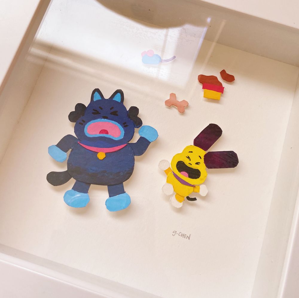A paper cut illustration of two characters from the show We Lost Our Human: a blue cat character and yellow dog, along with props from the show, set against a white background.