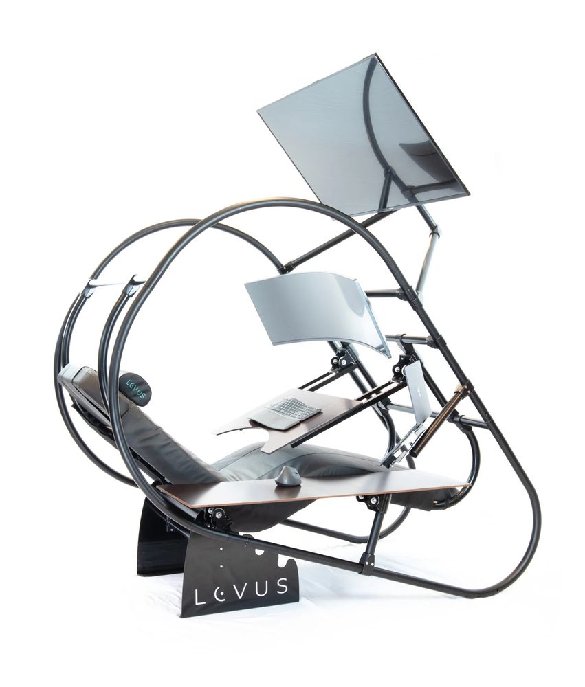 Picture of a reclining chair with monitor and keyboard stand. 