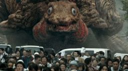 shin godzilla form number 2 basically an armless but not harmless godzilla with big exposed gills that scuttles around on its belly. in front of godzilla is many terrified peoples