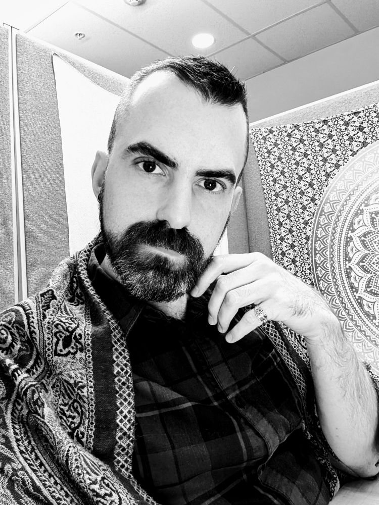 Black and white cubicle selfie of me giving an intense gaze