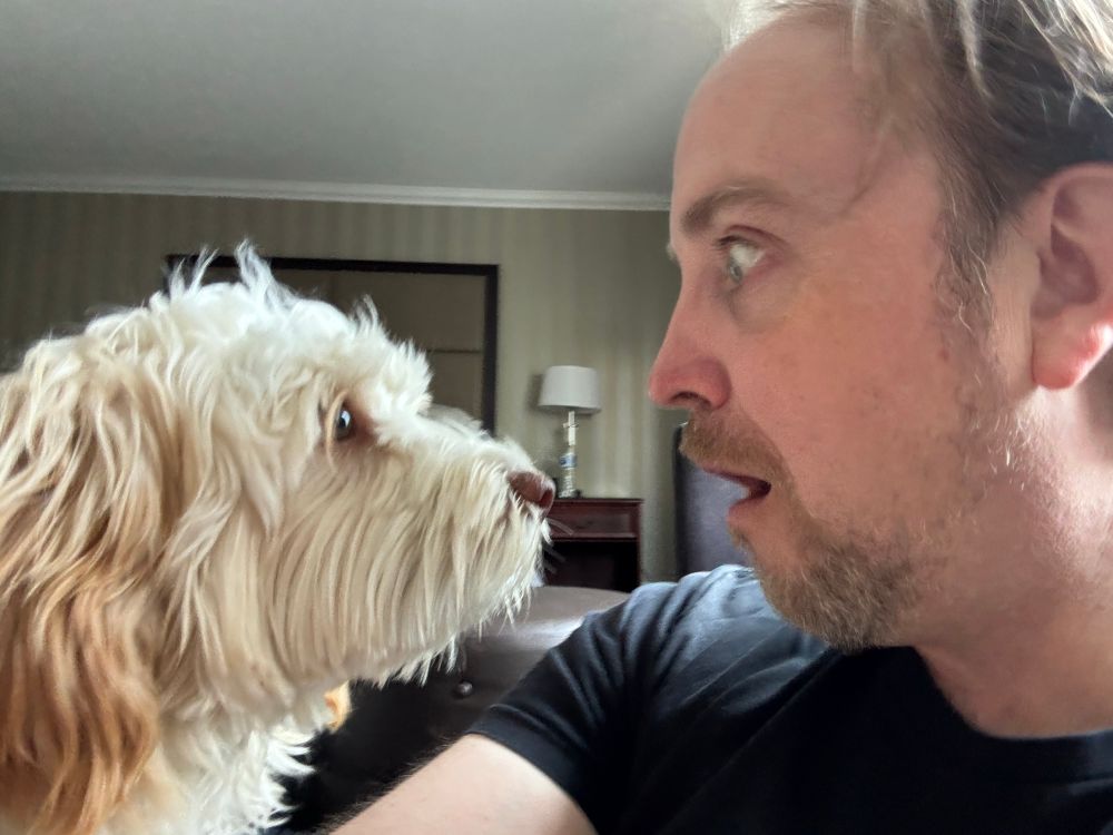 Me losing a staring contest with my dog friend