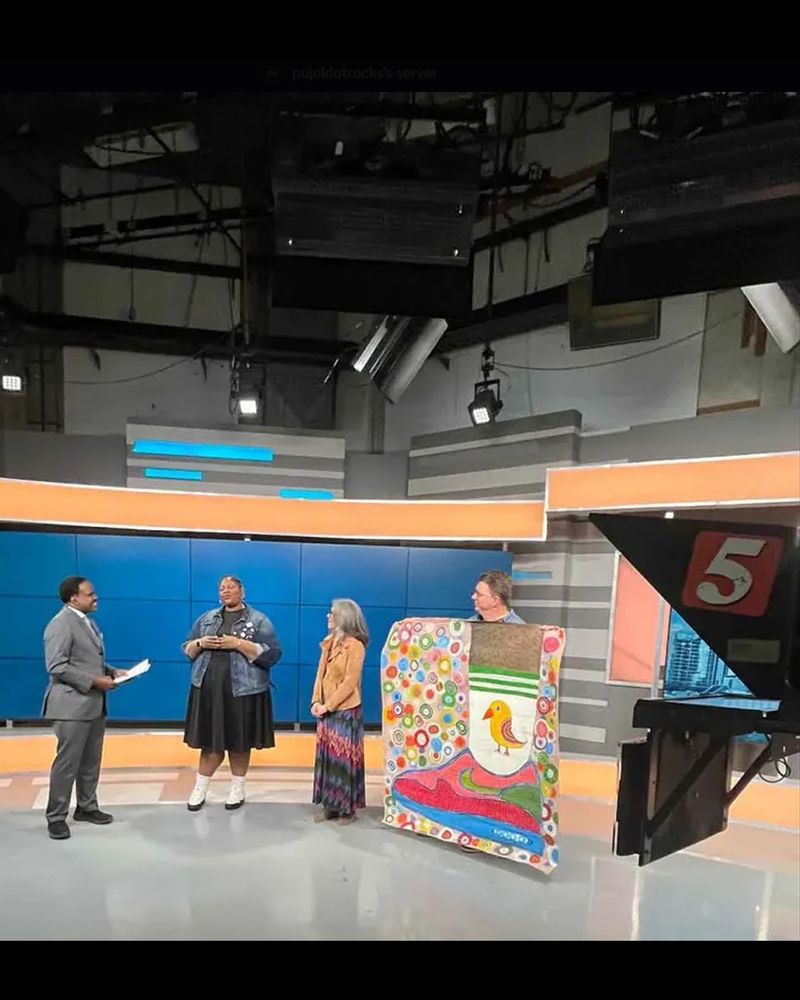 A photo of a Talk of the Town filming at WTVF Channel 5 that features Arcade Arts Nashville Executive Director Mollye Brown, Fab Glance Content Creator and Digital Strategist Melissa Watkins of Fab Glance, resident Arcade Arts artist “mikewindy” a.k.a Mike Mitchell, and host Lelan Statom.
