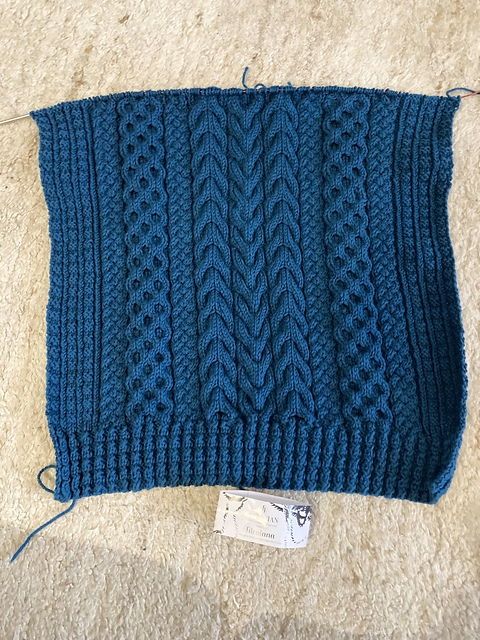 Beginning of a petrol blue Na Craga sweater.