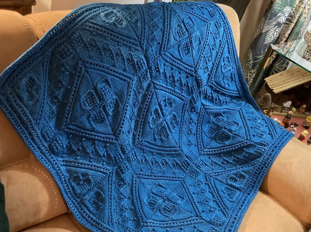 A petrol blue cabled plaid. Design is Mo Chridhe by Alice Starmore.