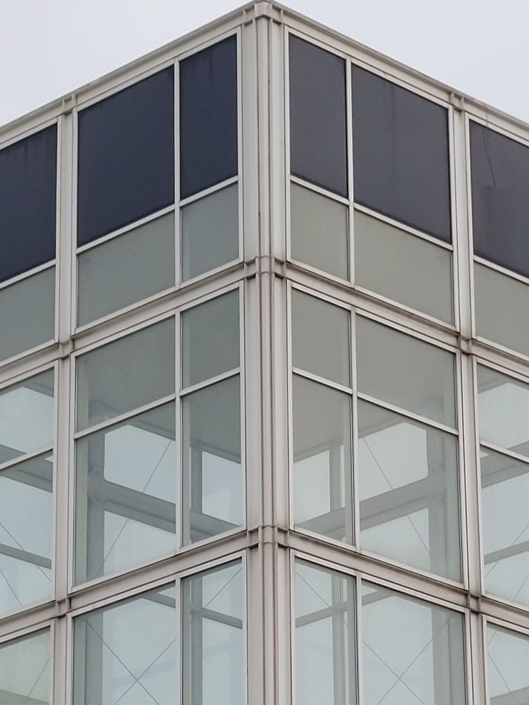 Metal and glass structure on top of local supermarket which may be part of the atrium as you enter the store 