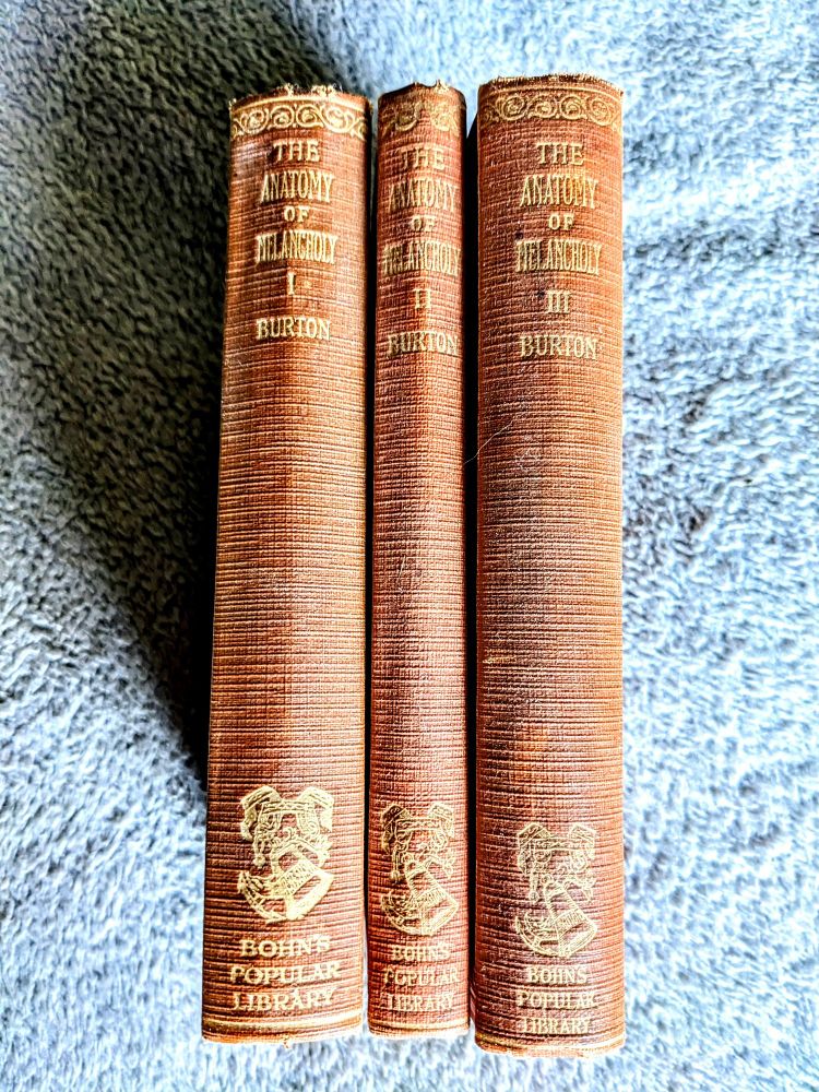 A photo of the 1927 Bohn's Popular Library three volume edition of The Anatomy of Melancholy by Robert Burton.