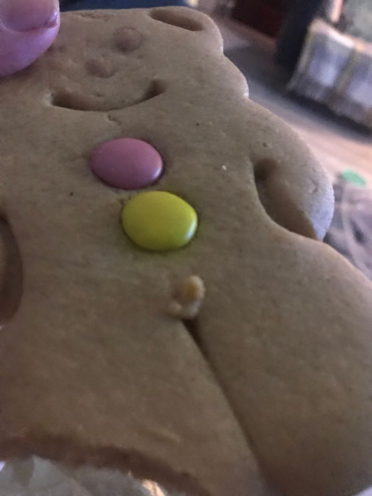 A gingerbread man with a defect in its crotch area making it look like it had a tiny penis and testicles.